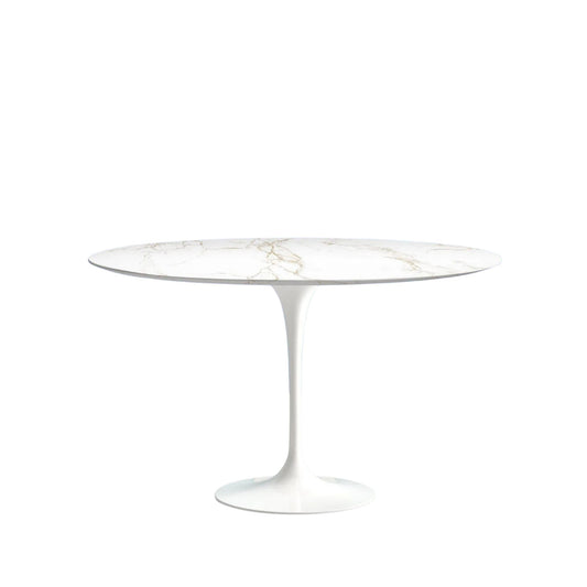 Round glass table with white pedestal base on a white background