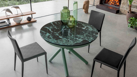 Helios round coffee table by Altacom transformed into a dining table with green marble-effect ceramic top