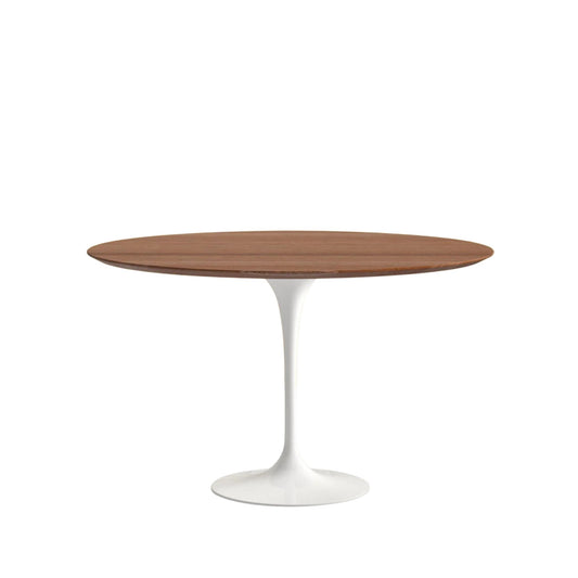 Dining table with wooden top and white base on a white background