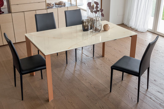 Close-up of Altacom ceramic extendable table with beige marble effect surface