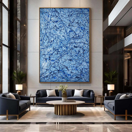 Modern living room with abstract blue artwork on the wall