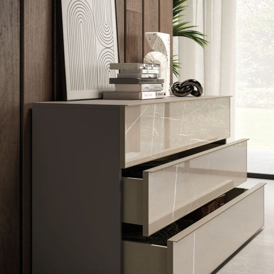 Modern interior design with a stylish cabinet, books, and decorative items.