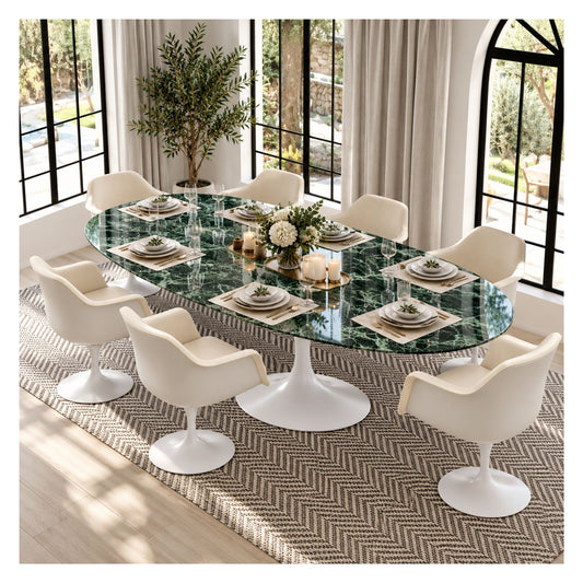 Large oval Tulip executive table with a glossy green marble top and white pedestal base, surrounded by cream upholstered chairs in a bright meeting room.