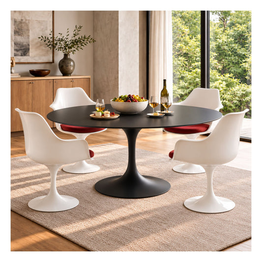 Black round Tulip Dining Table with a matte black pedestal base paired with four white Eero Saarinen Tulip Dining Chairs featuring red upholstered seats in a bright contemporary dining room.