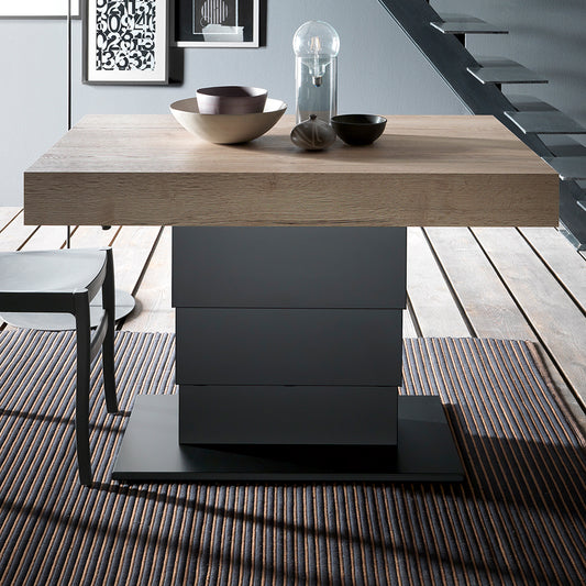 Ares Wing Altacom convertible table raised to dining height showing gas lift mechanism and central column