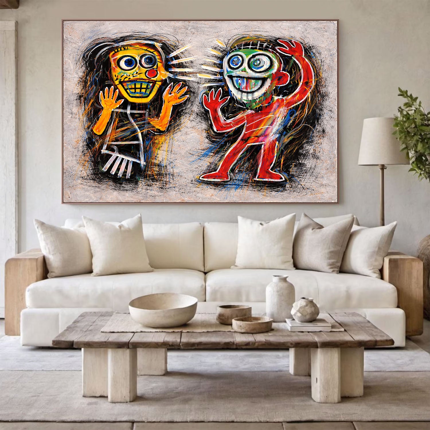 Modern living room with a colorful abstract painting above a white sofa.