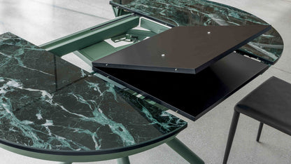 Helios transforming table by Altacom shown open with hidden extension mechanism and folding tabletop sections