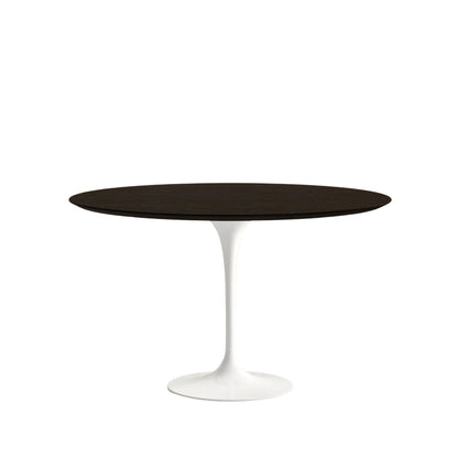 Round table with black top and white base on a white background