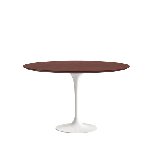 Round table with a dark brown top and white base on a white background