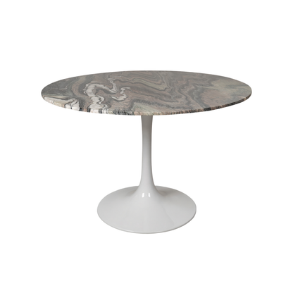 Round marble table with a white base on a white background