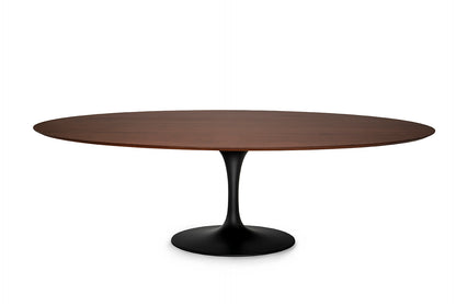 Oval tulip dining table with walnut effect top and black pedestal base in Saarinen style