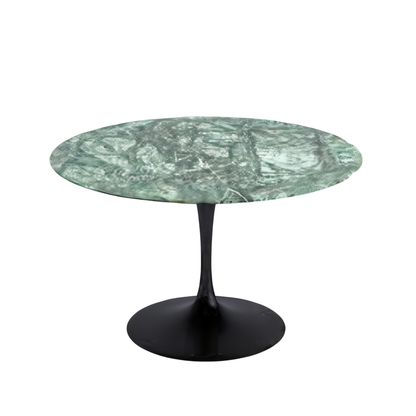 Round marble table with green pattern and black base on a white background