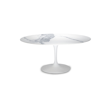 Round marble tulip dining table with a white base on a white background