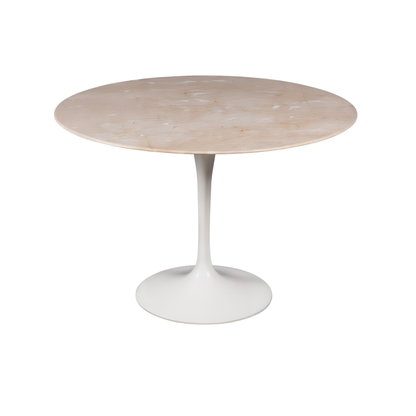 Round marble table with a white pedestal base on a white background