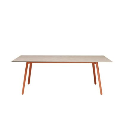 SCAB Squid extendable dining table in the closed position featuring a rectangular HPL tabletop with terracotta die-cast aluminium legs, designed for modern indoor and outdoor dining.