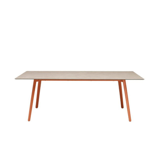 SCAB Squid extendable dining table in the closed position featuring a rectangular HPL tabletop with terracotta die-cast aluminium legs, designed for modern indoor and outdoor dining.