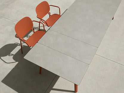 Close-up overhead view of the SCAB Squid extendable HPL tabletop showing the integrated extension mechanism and contemporary die-cast aluminium frame for indoor and outdoor dining.
