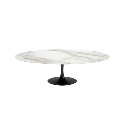 Round marble coffee table with a black base on a white background