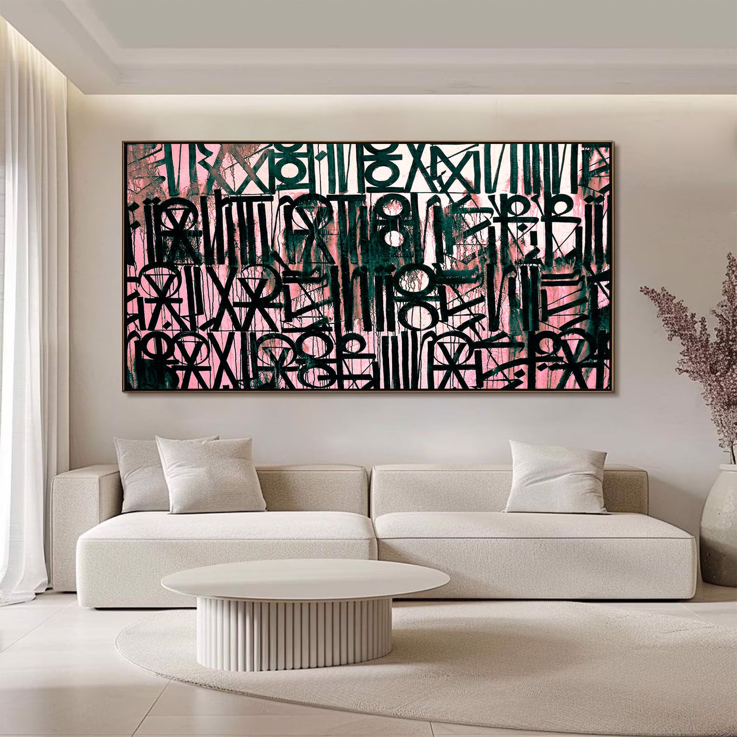 Abstract artwork in a modern living room with a white sofa and coffee table.