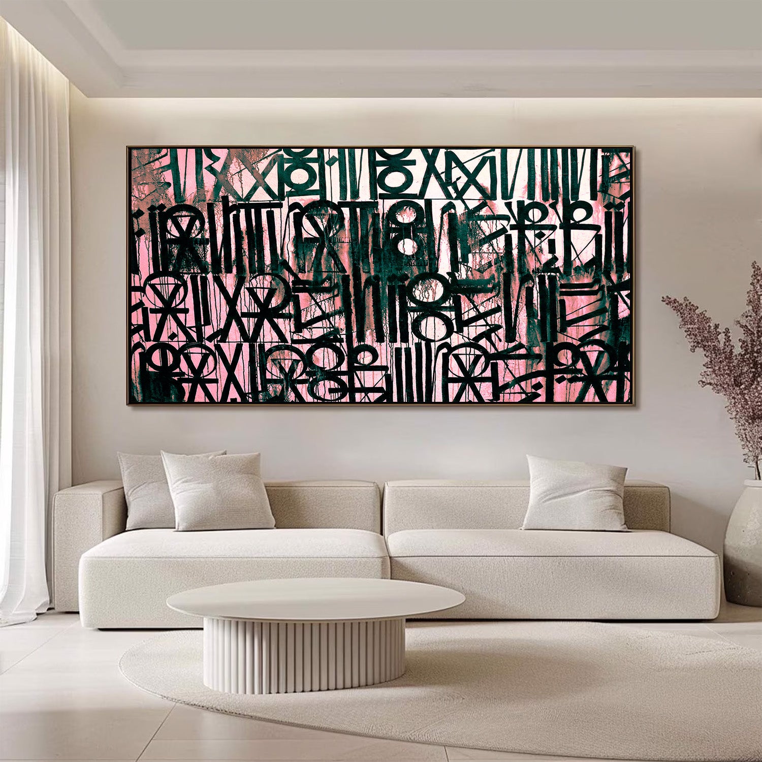 Abstract artwork in a modern living room with a white sofa and coffee table.