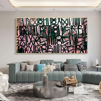 Living room with a large abstract painting on the wall, a gray sofa, and decorative items.