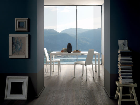 Altacom minimal white dining table in closed position with two chairs