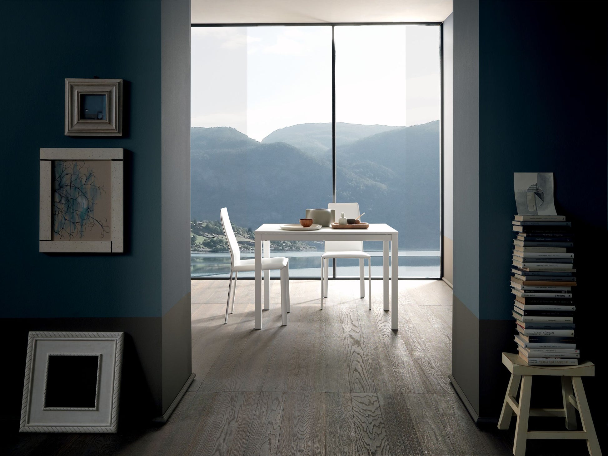 Altacom extendable table opened near window with mountain view modern home