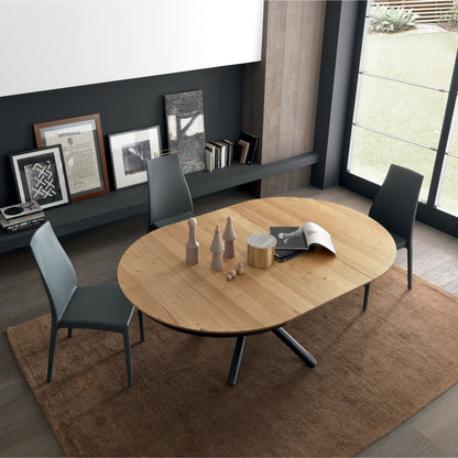 Dining room with a wooden table and chairs in a modern interior setting.