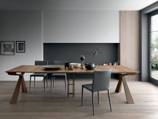 Altacom Genesi transformable table fully extended into modern wooden dining table in contemporary living space