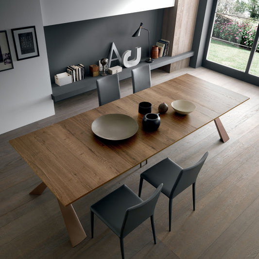 Altacom Genesi console table fully extended into large wooden dining table with modern chairs