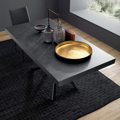 Top view of modern extendable dining table with ceramic surface and decor