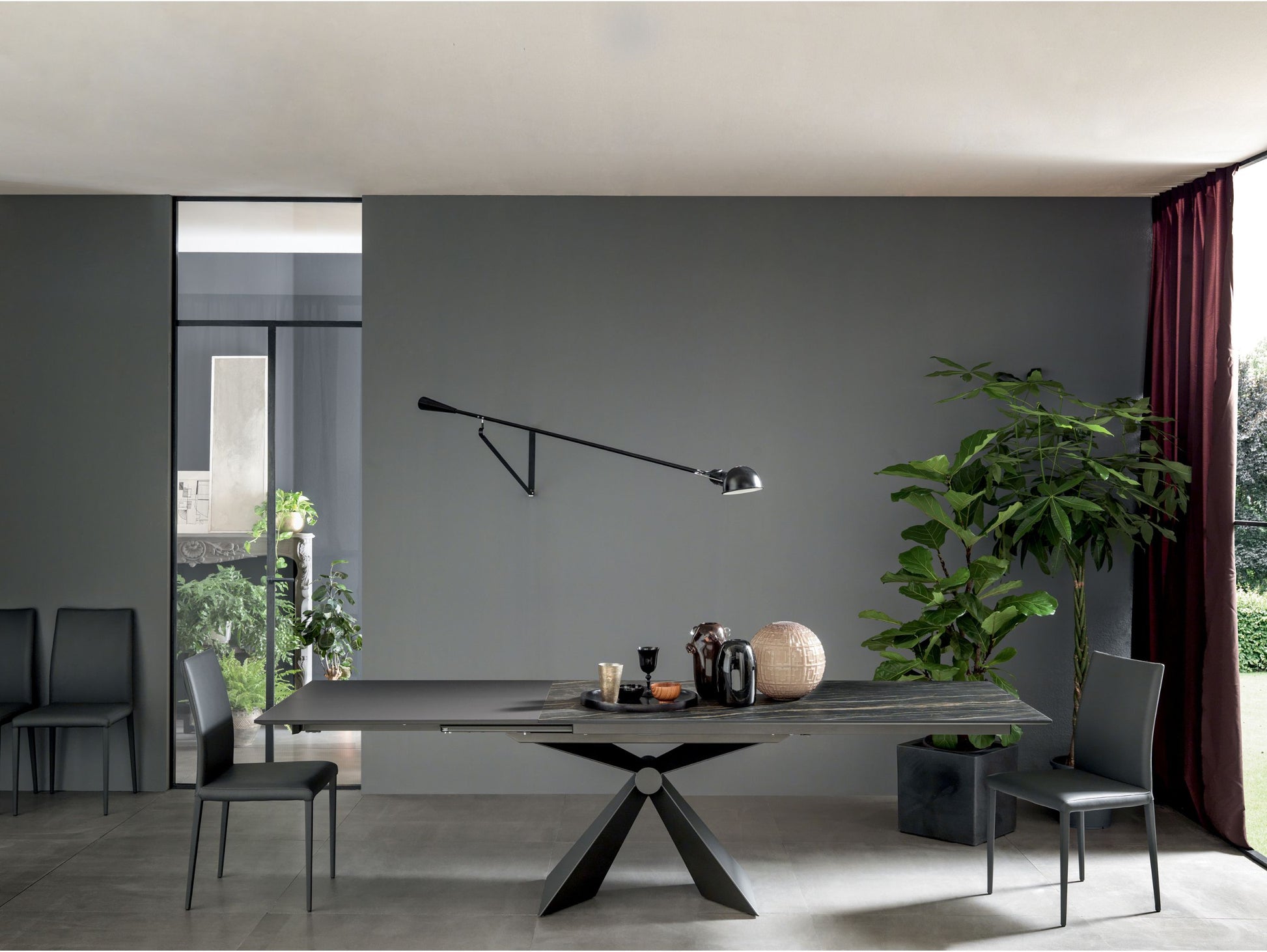 Altacom Sintesi extendable dining table with dark ceramic surface in modern interior setting