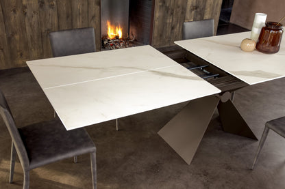 Altacom Sintesi extendable table showing opening extension mechanism with ceramic top panels