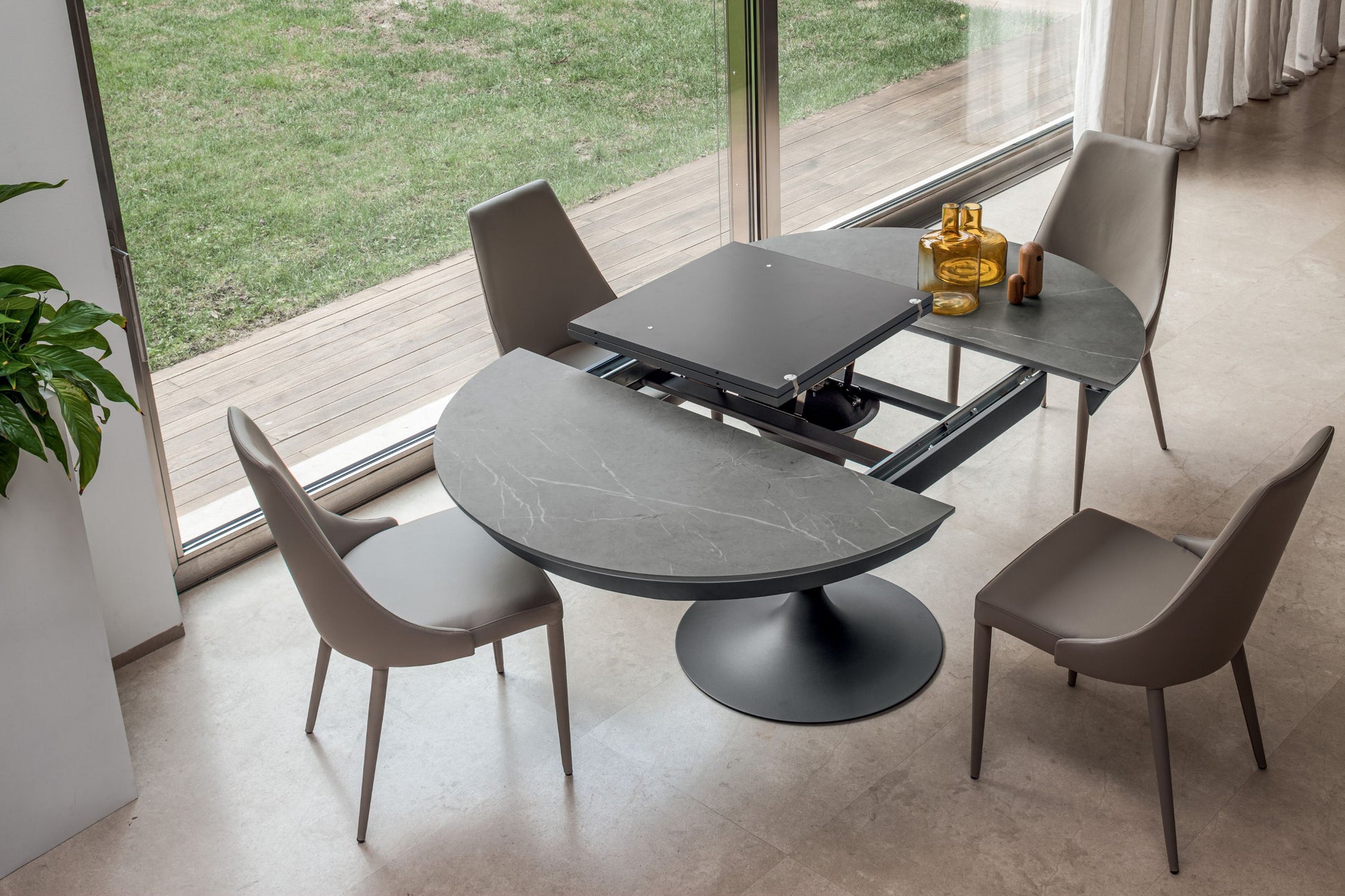 Underneath view of pedestal table extension system and structure