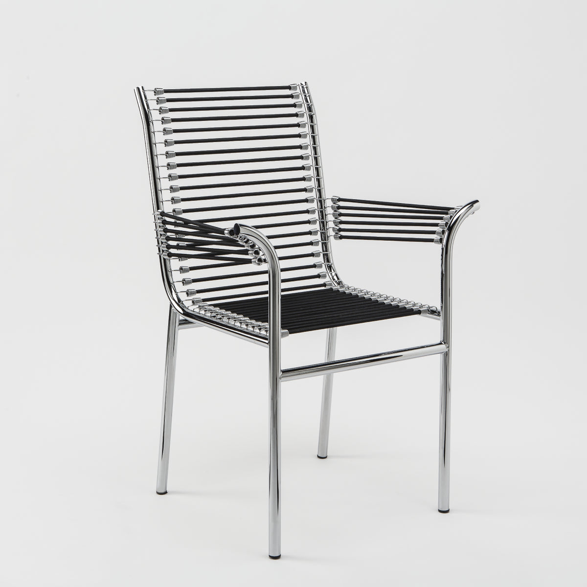 Belotti-inspired Spaghetti armchair with a polished chrome tubular steel frame, black PVC cord seat and backrest, combining iconic Italian design with lightweight comfort for contemporary dining and hospitality interiors.