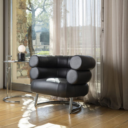 Bibendum armchair upholstered in black leather with a polished chrome tubular steel frame, featuring iconic cylindrical cushioned armrests and backrest, ideal for luxury living rooms, hotel lounges and contemporary designer interiors.