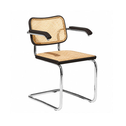 Black Cesca cane armchair by Marcel Breuer featuring an ebonized beech frame, natural woven cane seat and back, solid wood armrests, and a polished chrome cantilever base on a white background.