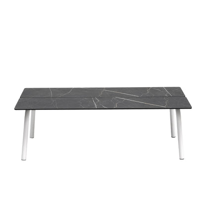 Front view of the S•CAB Brezza outdoor coffee table with a dark marble-effect rectangular tabletop and white rounded metal legs.