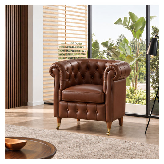 Brown Chesterfield-inspired armchair with rolled arms and brass castors in a bright living room
