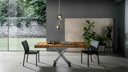 Calypso transforming dining table by Altacom with thick old oak wood top and polished chrome metal base in a contemporary dining room