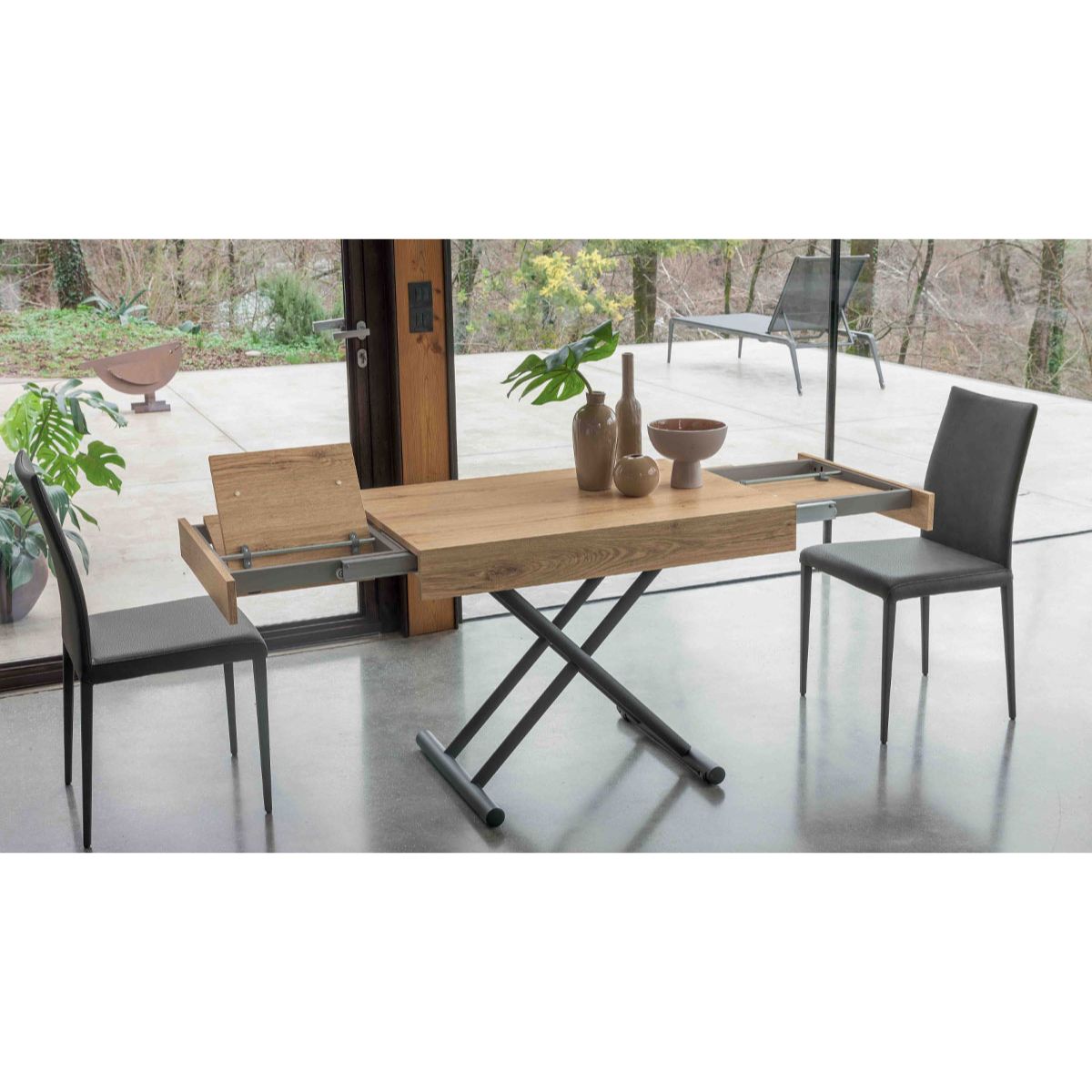 Compact convertible table by Altacom with extension leaves open showing transforming mechanism and expandable surface