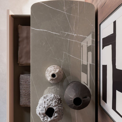 Decorative vases on a marble-patterned surface with a modern interior setting.