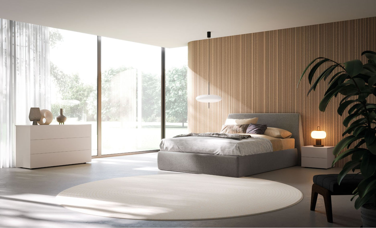 Modern bedroom with a bed, dresser, and large windows.