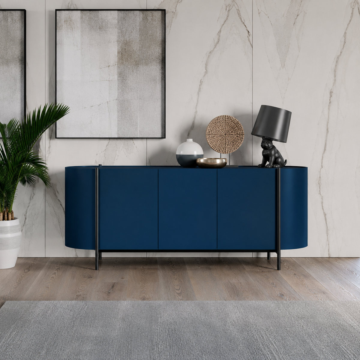 Dall'Agnese Supernova modern navy blue sideboard or credenza with curved front panels and slim black legs, styled in a contemporary room with a marble wall, framed art, a potted plant, and decorative objects on top.