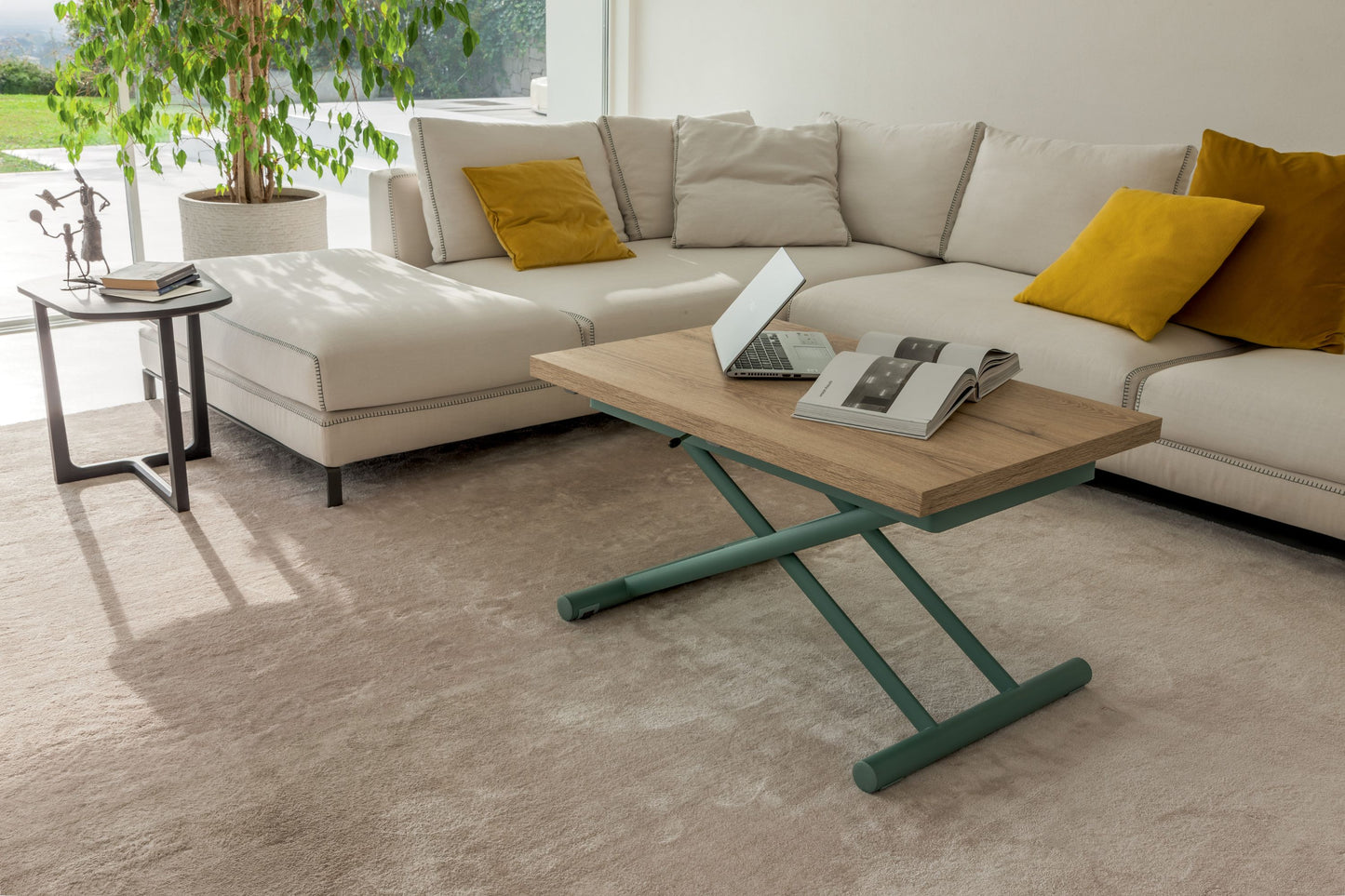 Extendable oak coffee table with green base in modern living room with sofa