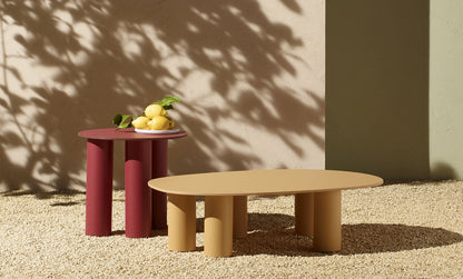 S•CAB Hyppo outdoor coffee tables in two heights and colours displayed in a contemporary garden setting.