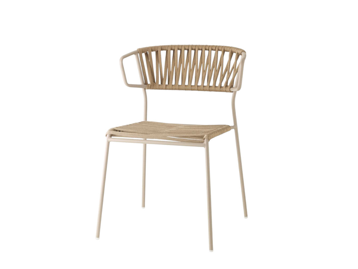 Front angled view of the Lisa Club chair with a cream metal frame, beige woven seat and backrest, and integrated armrests.