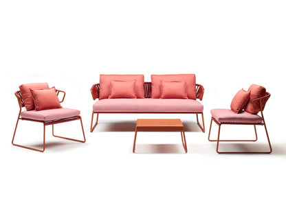Lisa Club outdoor lounge set with a coral sofa, matching lounge chairs, and coffee table on a clean white background.