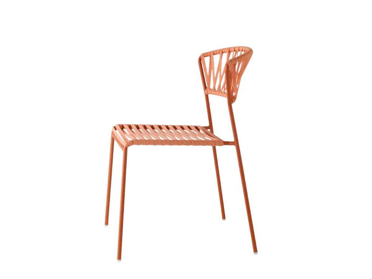 Side view of the Lisa Filò chair with a terracotta woven rope seat and backrest on a slim matching metal frame.