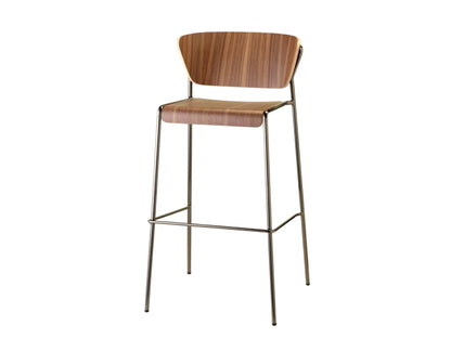 Front view of the Lisa Wood bar stool with a walnut plywood seat and backrest, slim dark metal frame, and integrated footrest.